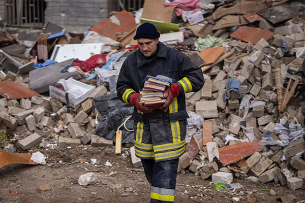 fire fighter carrying books