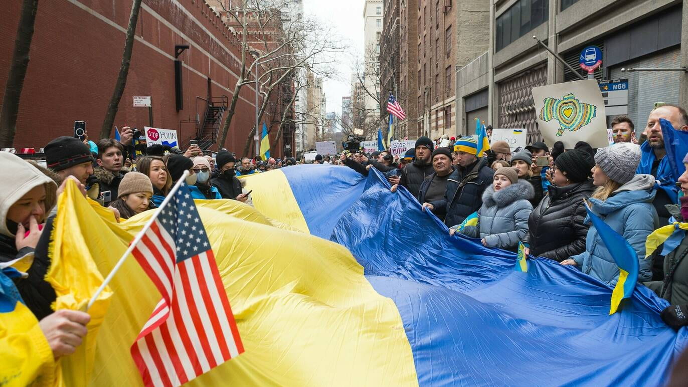 group demonstration, Ukrainian and American flags